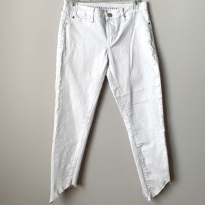 ARTICLES OF SOCIETY | white asymmetrical raw hem skinny jeans